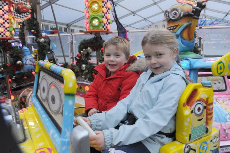 Daniel, three, and sister Tabitha Smithson-Brook, six, of Cookridge, pictured on one of the fair rides.