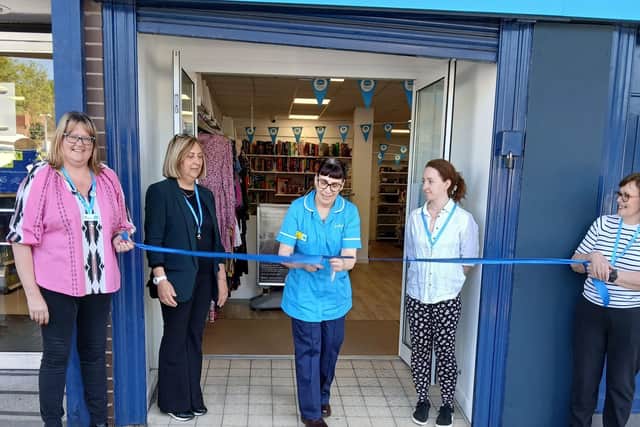 Sue Ryder Nurse, Sally Hudson, officially declares Sue Ryder's Bramley shop open. Also pictured are Sue Ryder retail staff.