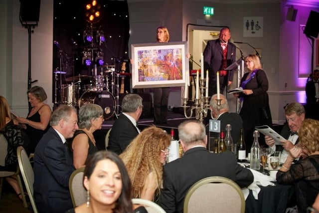 James-Howitt-White conducts the auction which helped raise a grand total of £50,000.