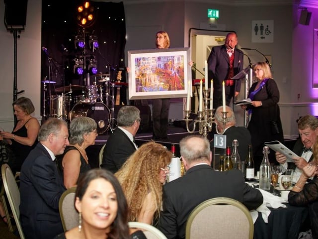 James-Howitt-White conducts the auction which helped raise a grand total of £50,000.