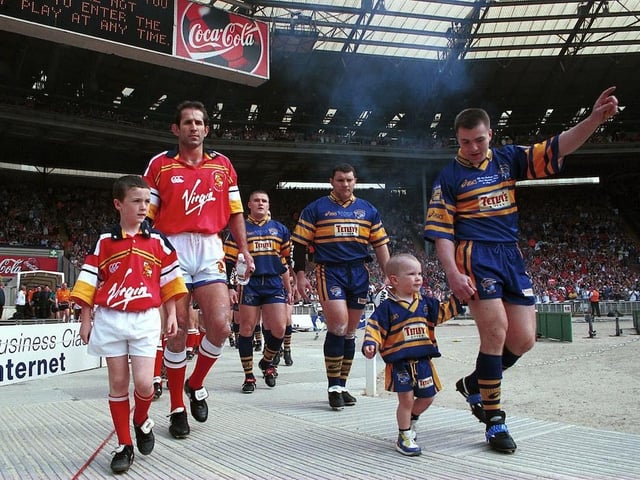 Iestyn Harris and mascot Billy McDermott lead Leeds Rhinos out to face London Broncos in the 1999 Challenge Cup final, the last at the old Wembley.