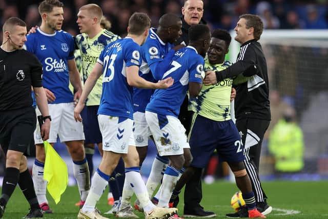 'DISASTER': Tempers flare after Leeds United's 1-0 defeat at Everton as caretaker boss Michael Skubala holds back Willy Gnonto. Photo by Clive Brunskill/Getty Images.