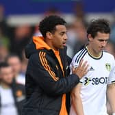 LEEDS, ENGLAND - MAY 28: Tyler Adams consoles Brenden Aaronson of Leeds after the Premier League match between Leeds United and Tottenham Hotspur at Elland Road on May 28, 2023 in Leeds, England. (Photo by Stu Forster/Getty Images)