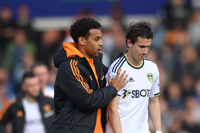 LEEDS, ENGLAND - MAY 28: Tyler Adams consoles Brenden Aaronson of Leeds after the Premier League match between Leeds United and Tottenham Hotspur at Elland Road on May 28, 2023 in Leeds, England. (Photo by Stu Forster/Getty Images)