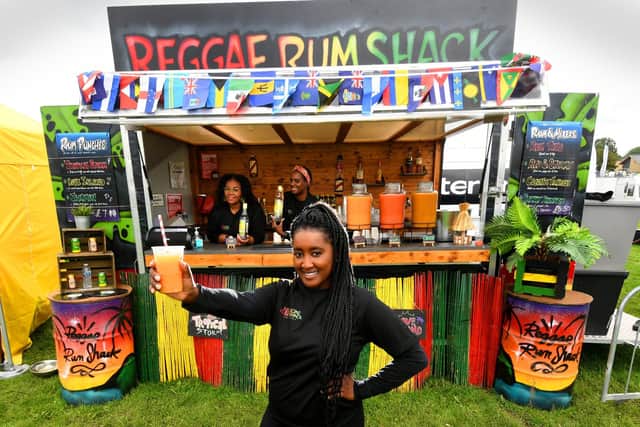 The Riverside Food Festival, Wetherby. Cherrelle Davis (front) with Natasha Lewis and Saffia Morris from the Reggae Rum Shack Leeds, pictured at the festival.Picture taken by Yorkshire Post Photographer Simon Hulme 5th August 2023