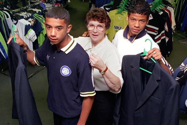 Rawcliffe's schoolwear manager Wirlys Taylor measures up Leeds United players Simon Johnson (left) and David Sherman.