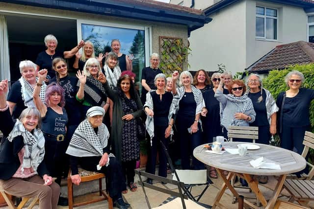 Members of Leeds' Women in Black, with some wearing a keffiyeh, a symbol of Palestine.