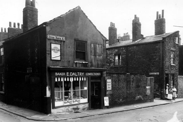 Upper North Street did not connect with North Street, which was the main road running to the north of the city from Vicar Lane to Meanwood Road/Sheepscar Street/Roundhay Road. On the left is Providence Place. Number 24 Upper North Street is a bakers shop, business of E. Daltry. On the right Providence Court is visible, then 22 Upper North Street. A group of women are outside this house. Pictured in August 1959.