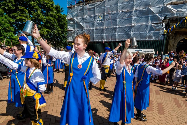 Raising a tankard to the crowds. Picture By Yorkshire Post Photographer,  James Hardisty. Date: 3rd June 2023.