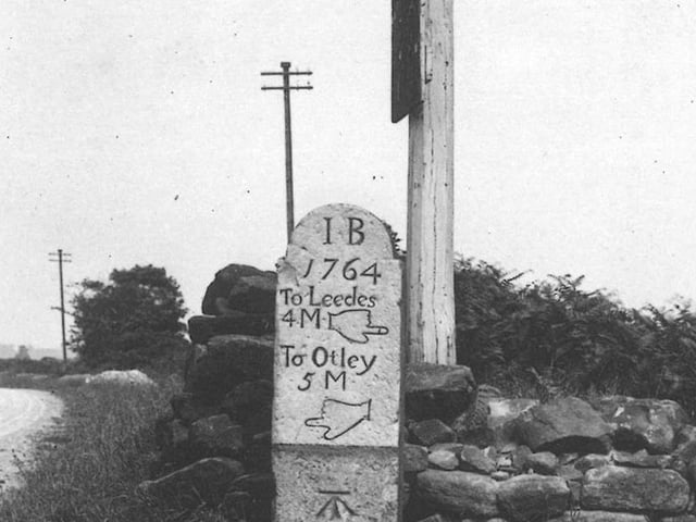 A milestone, at the junction of King Lane (foreground) and Alwoodley Lane dated 1764 points the way to Leedes, 4 miles and Otley, 5 miles. The grade II listed milestone still exists though it has been resited slightly as the area has become built up, and is now reset into a patch of soil on the pavement outside no. 2 Alwoodley Lane. Pictured in July 1906.