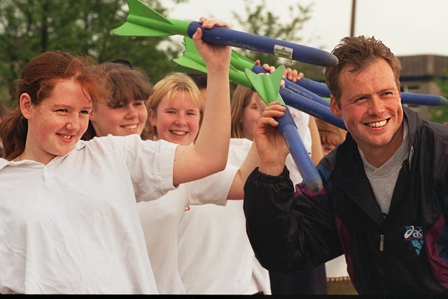 International javelin thrower Mick Hill visited his old school, Ralph Thoresby High to give lessons as part of his job as Leeds Sports Development, assistant athletics officer in June 1996.  He is pictured explaining technique, using safety javelins with Gemma Hill. (no relation)