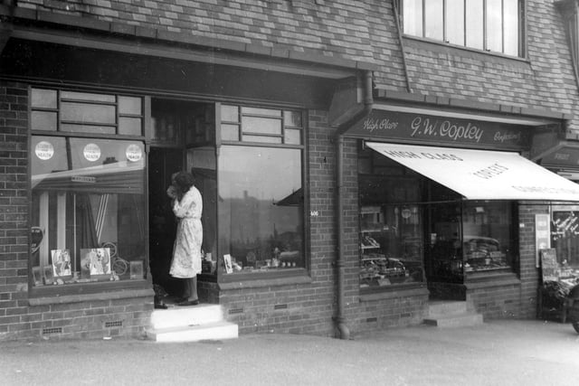 A view of George William Copley, Confectioner who was at 404 Burley Road. John Webster, Boot Repairer is on left at 406. Pictured in July 1937.