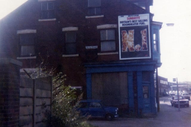 Looking along Wellington Road at the junction with Driver Street in October 1983. No.57 Wellington Road is on the corner; this former shop is here boarded up and soon to be demolished. Its previous occupants have included Harry Hyman, draper. An advertising hoarding on the wall is promoting Sunbrite, described as 'Britain's Best Selling Roomheater Fuel'.