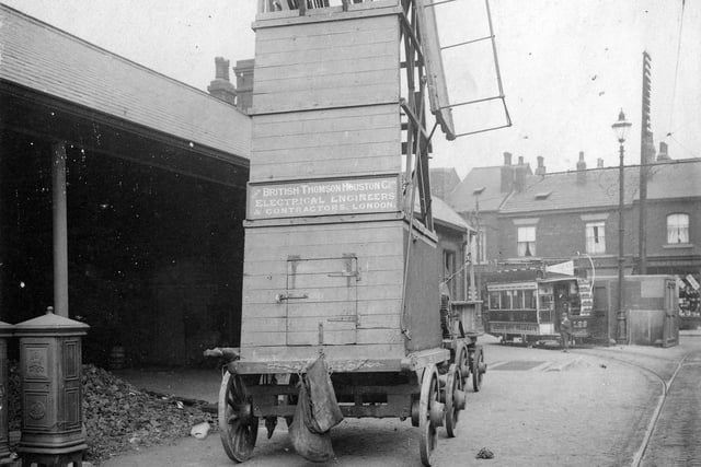 A  Leeds City Tramway's Overhead Wire Trolley outside the Kirkstall Road Tram Depot. Also known as a tower wagon or derrick, it was used to carry out repairs to overhead wiring. This horse-drawn vehicle would appear to be the first one acquired by Leeds City Tramways, which started in service around December 1897, as others were not purchased until 1900. Horse-drawn derricks were particularly dangerous, liable to topple over, so a motorised derrick was introduced in 1903. It was not until about 1920 though that the horse-drawn ones were finally withdrawn from service.