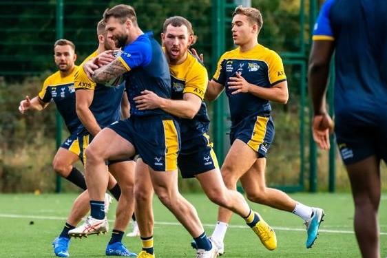 Cameron Smith gets to grips with his new Rhinos teammate Andy Ackers.