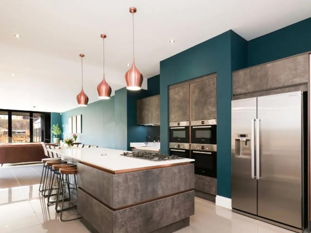 The house's ultra-modern kitchen isn't dull or boring like some contemporary dining rooms - it's full of quirky decor and design choices.