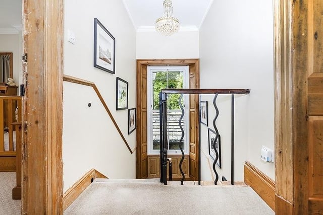 An open staircase leads up to the first floor landing and the bedrooms.