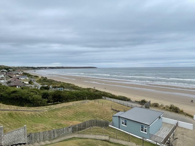 Looking down over one of the chalets to the award winning beach and seascape.