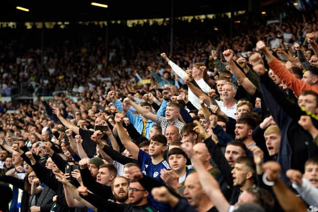 Leeds United supporters sing ahead of the English Premier League football match between Leeds United and Liverpool at Elland Road in Leeds, northern England on September 12, 2021. - (Photo by OLI SCARFF/AFP via Getty Images)