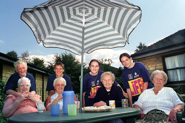 Pupils from Woodkirk High School took part in the West Yorkshire Lifestyle Project to raise funds to provide garden furniture for the residents of Siegan Manor in Morley in August 1998. Pictured are pupils, from left, John Nall, Jonathan Harrison,  Laura Kurij and her sister Nina. Residents, from left, are Laura Fox, Fay McMeekin, Lilian Potter and Irene Broadhead.