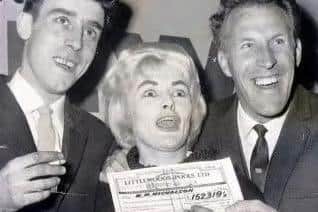 Bruce Forsyth presenting Viv Nicholson and husband Keith with their cheque.