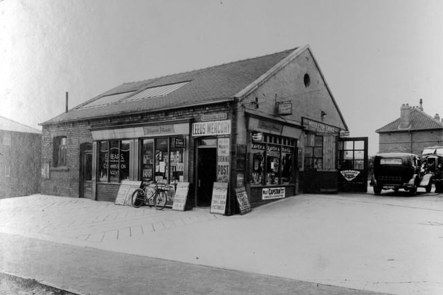 Sissons Road on to Middleton Garage which is on Middleton Park Road. Businesses on the left are at number 2 Sissons Road, Morris Newsagents with E. Heaps, Turf Commission Agents at number 4. Pictured in July 1939.