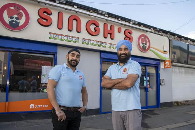 Harmeet and Harvinder Singh, co-owners of Singh's Indian Street Food which has reopened after being hit by a fire (Photo: Tony Johnson)