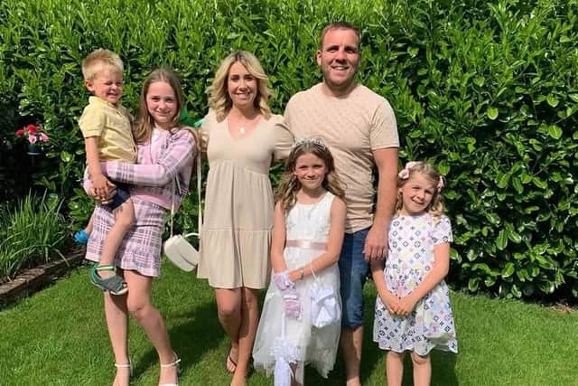 Rebecca with her family. She is now sharing her story to back a charity campaign aimed at tackling the stigma around gut health.