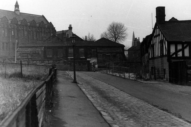 Institution Street looking west towards Raglan Road. In the background on the left is the March Institute, built around the turn of the 20th century as the Parish Hall of St. Mark's, a gift of the Misses March. Later it became a veneer works but has since been demolished. The area is now taken up with the Holborns.