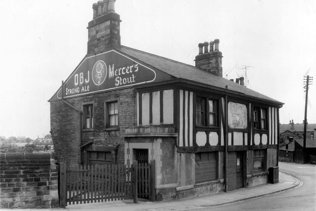 The mock tudor front of the Station Hotel on Wyther Lane pictured in July 1959. On the gable end of the building OBJ Strong Ale and Mercer's Stout are promoted. Visible behind the building on the left is the roof top of the Headingley R.U.F.C.