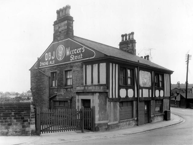 The mock tudor front of the Station Hotel on Wyther Lane pictured in July 1959. On the gable end of the building OBJ Strong Ale and Mercer's Stout are promoted. Visible behind the building on the left is the roof top of the Headingley R.U.F.C.