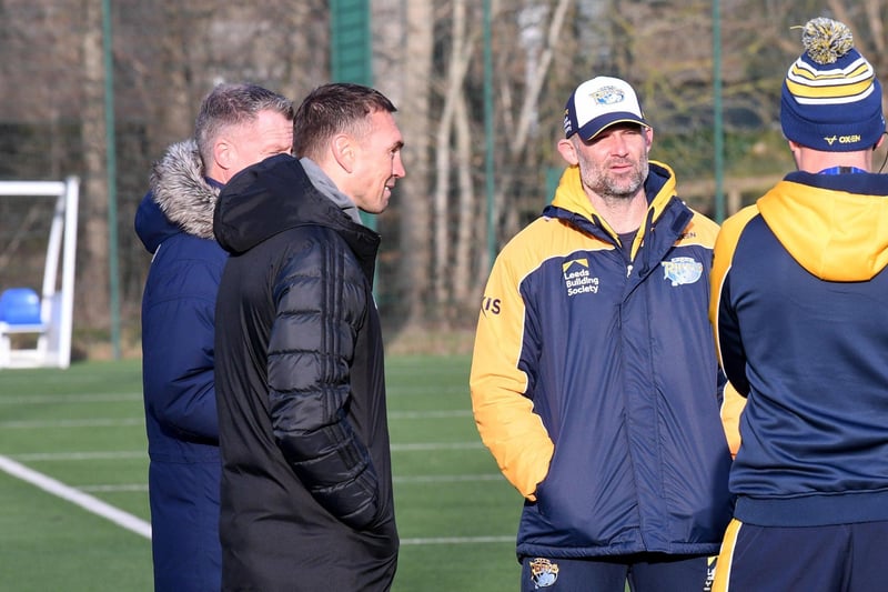 Rhinos' former captain (black coat) chats to the head-coach at training on Thursday.