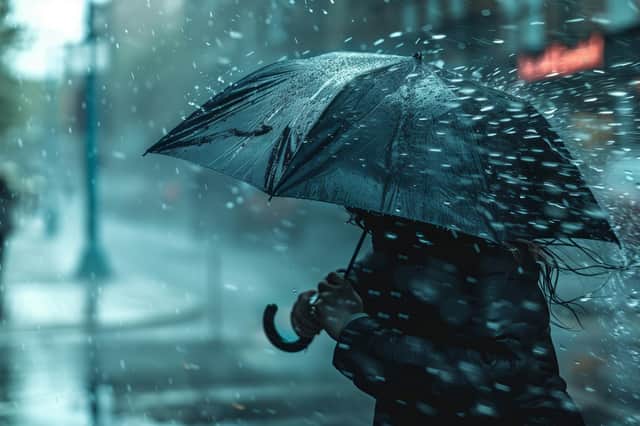 Stoke image of a person walking with an umbrella.