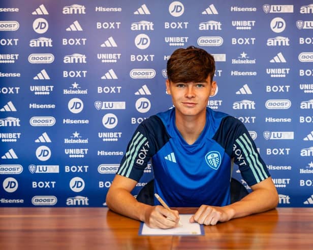 THRIVING: Seventeen-year-old Leeds United midfielder Charlie Crew, pictured signing his first pro contract with the Whites earlier this summer.