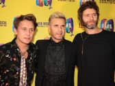 Mark Owen, Gary Barlow, and Howard Donald of Take That, who have announced a new UK tour including dates in Leeds.