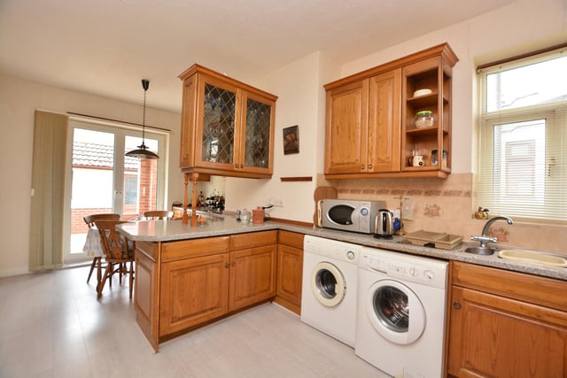 There is also a well-proportioned kitchen with patio doors leading to the rear terrace and gardens.