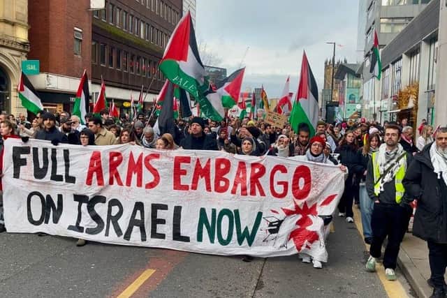 Pro-Palestine demonstrators march through Manchester during the Christmas markets, calling for justice and an end to the ongoing conflict.