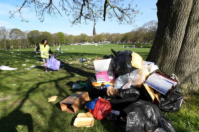 Volunteers clear up the rubbish on Woodhouse Moor, Leeds, after the 4/20 event (Photo: Simon Hulme)