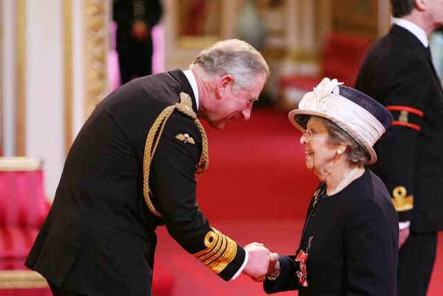 Dr Marjorie Ziff is made a Member of the British Empire by the then Prince of Wales at Buckingham Palace in 2011. Picture: Martin Keene/PA Wire.