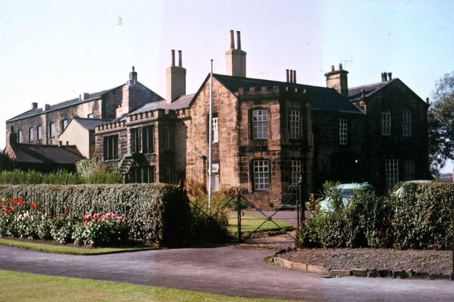 A view of the dahlias in Scarth Gardens in front of Morley Hall when it was being used as a Maternity Home. The picture also shows the relation of Morley Hall to the three-storey handloom building built just behind the Hall in the mid-19th century when families with an interest in trade lived at Morley Hall. Pictured in September 1963.