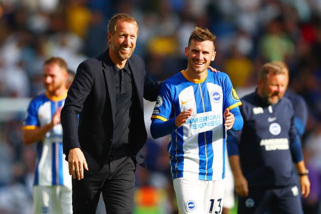 BRIGHTON, ENGLAND - AUGUST 27: Graham Potter, Manager of Brighton & Hove Albion and Pascal Gross of Brighton & Hove Albion interact following the Premier League match between Brighton & Hove Albion and Leeds United at American Express Community Stadium on August 27, 2022 in Brighton, England. (Photo by Bryn Lennon/Getty Images)
