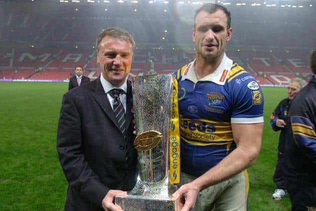 Chief executive Gary Hetherington with star player Jamie Peacock after Leeds Rhinos retained the Super League trophy at Old Trafford in 2008. Picture by Steve Riding.