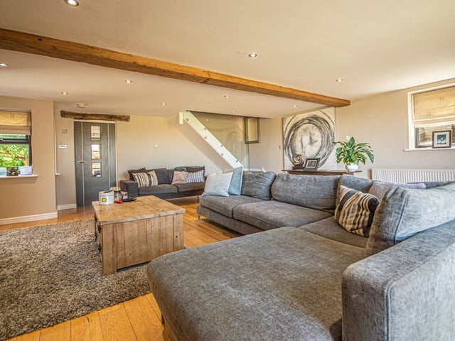 An alternative view of the lounge, with staircase to the rear.