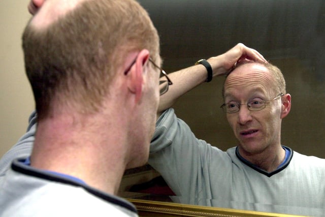 This is solicitor Paul Grindley who was also a part-time comedian. He is pictured practising in front of the mirror at his home in Guiseley in February 2003.
