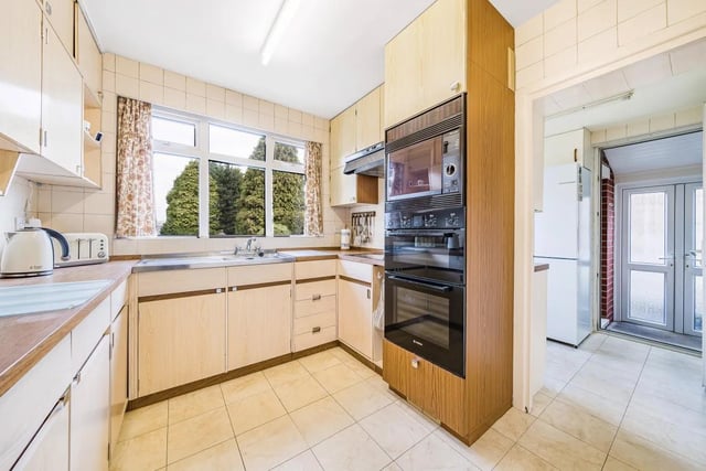 The kitchen is located at the rear of the house and as such has a terrific view of the stunning garden - washing the dishes has never been so sought after.