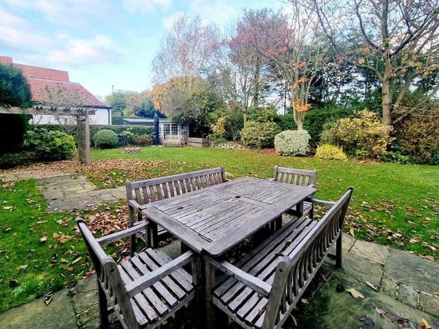 Outdoor dining space, with views across the garden.