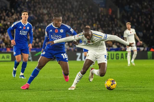 MAN OF THE MATCH: Leeds United midfielder Glen Kamara, right, battles it out with Leicester City's Abdul Fatawu during Friday night's Championship clash at the King Power. 
Picture by Bruce Rollinson.