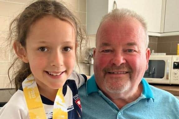 Isabella Roberts with her grandad Stephen Welsh. Isabella is raising money for the Rob Burrow Centre for MND Appeal as her grandad was diagnosed with the disease earlier this year.