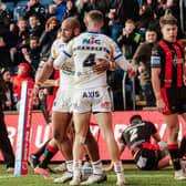 Maika Sivo and Ash Handley celebrate after the winger's third try in Leeds Rhinos' 26-22 win against Warrington Wolves. Picture by Alex Whitehead/SWpix.com.
