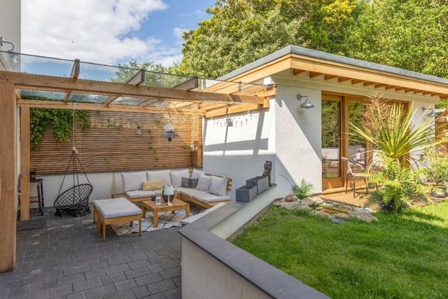 The covered, sunken terrace in a sheltered spot is ideal for entertaining.